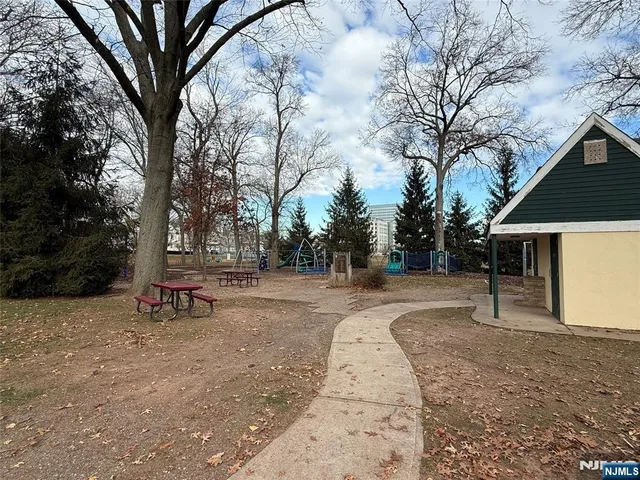 a view of a yard with snow on the road