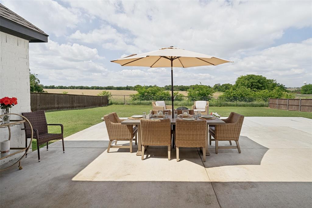 9424 Wildcat Ridge Godley, TX 76044 - Photo 21 of 25 an outdoor space with furniture and umbrella