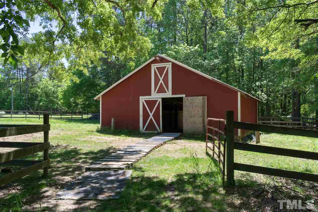 1702 Baptist Road Durham, NC 27703 - Photo 3 of 28 a backyard of a house with seating space