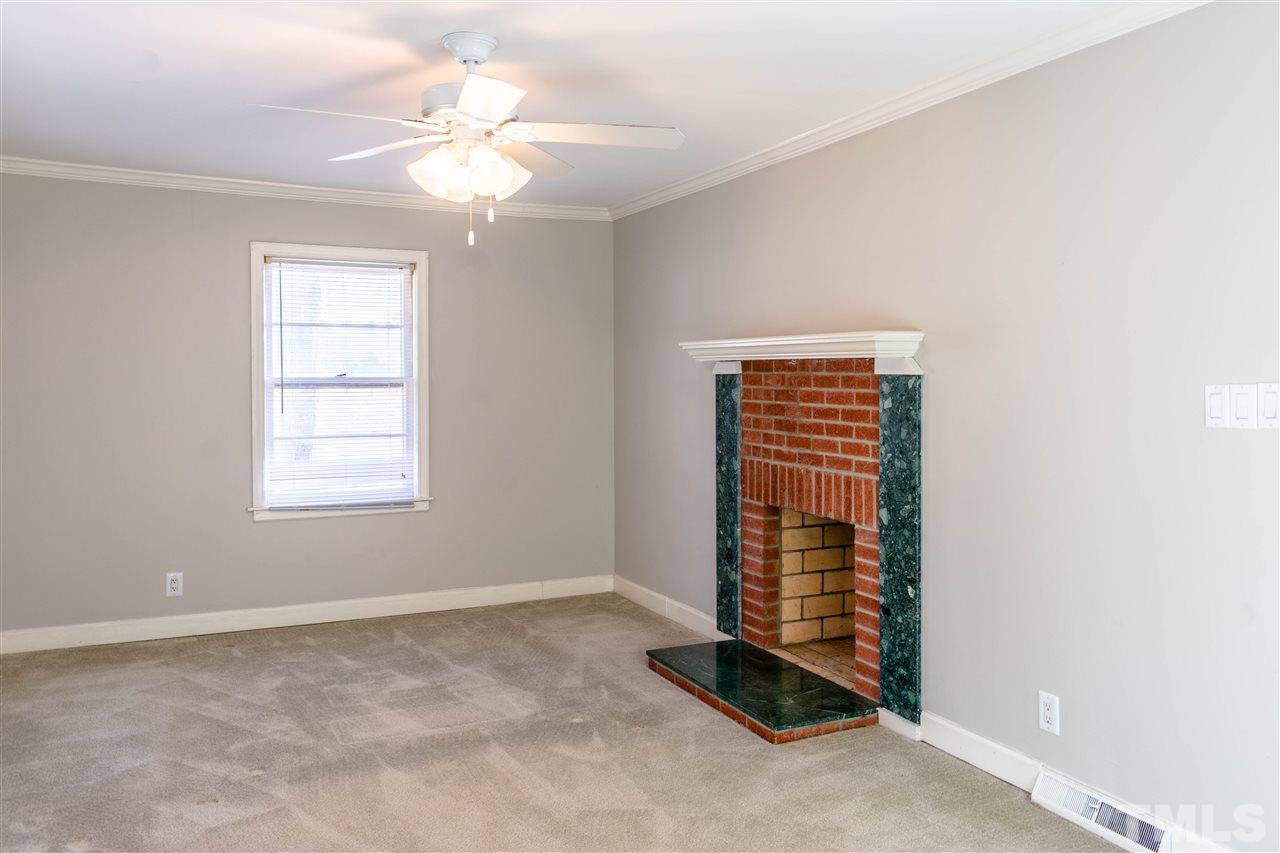1702 Baptist Road Durham, NC 27703 - Photo 22 of 28 a view of an empty room with a window