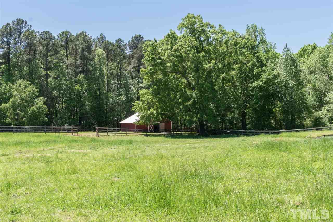 1702 Baptist Road Durham, NC 27703 - Photo 8 of 28 a swimming pool with trees in the background