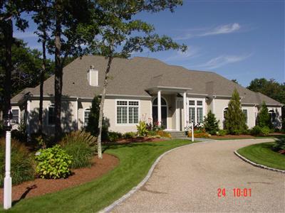 front view of a house with a yard
