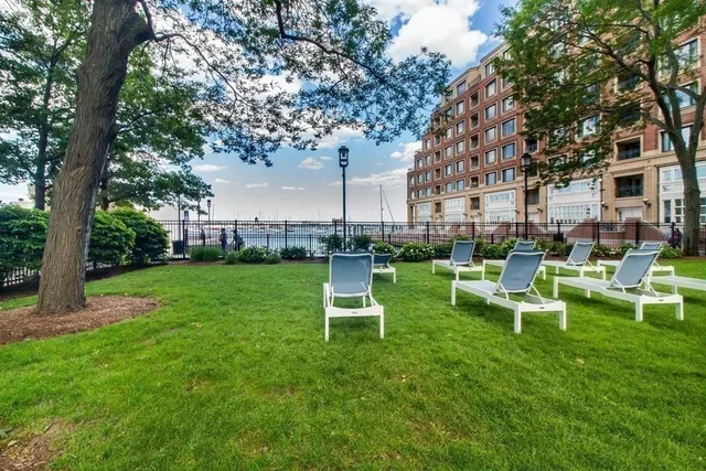 a view of a chair and table in the garden