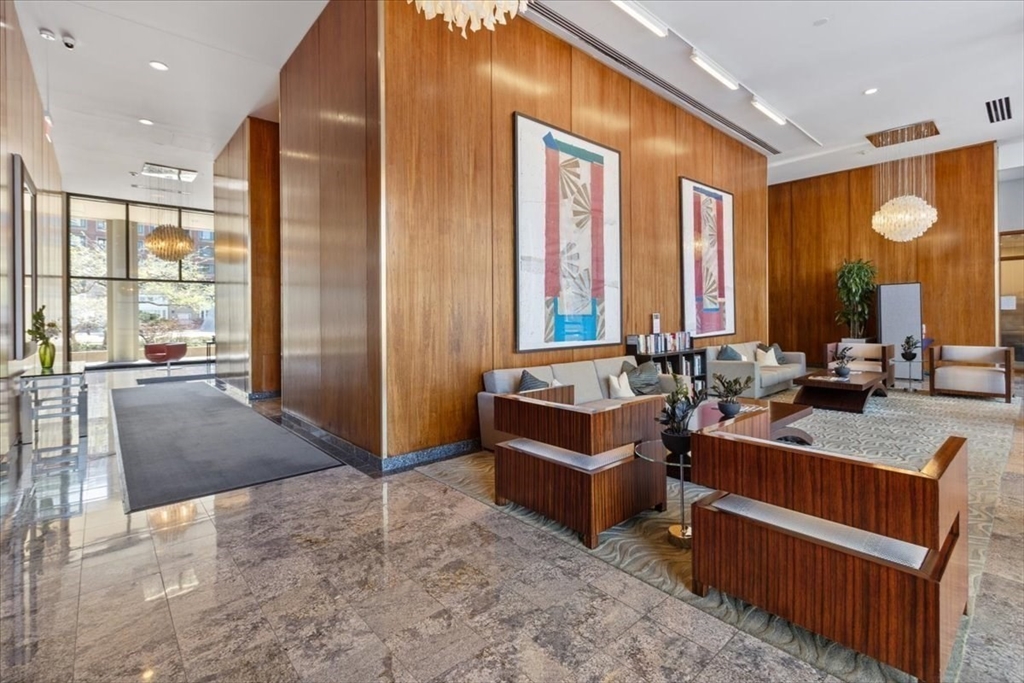 65 East India Row, Unit 22C Boston, MA 02110 - Photo 15 of 17 a lobby with furniture and large windows