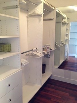65 East India Row, Unit 22C Boston, MA 02110 - Photo 9 of 17 a utility room with cabinets and wooden floor