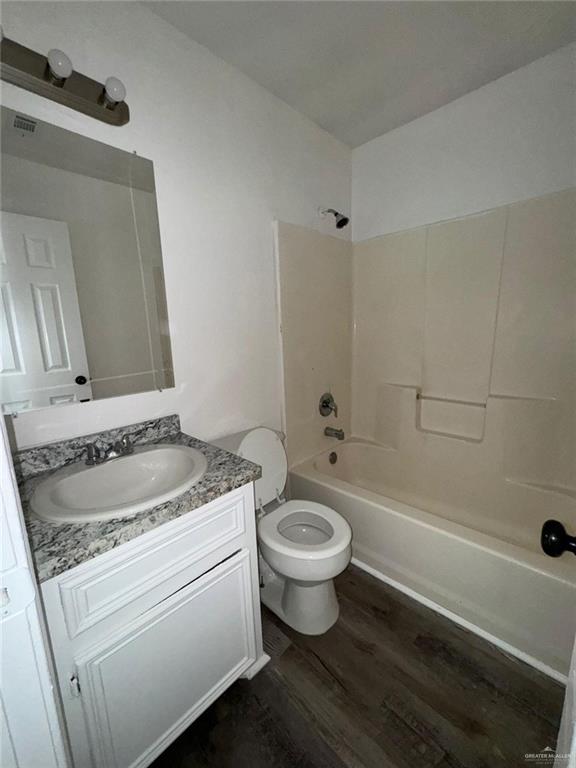 2504-2606 North M Road Edinburg, TX 78542 - Photo 6 of 9 a bathroom with a granite countertop toilet a sink and a bathtub