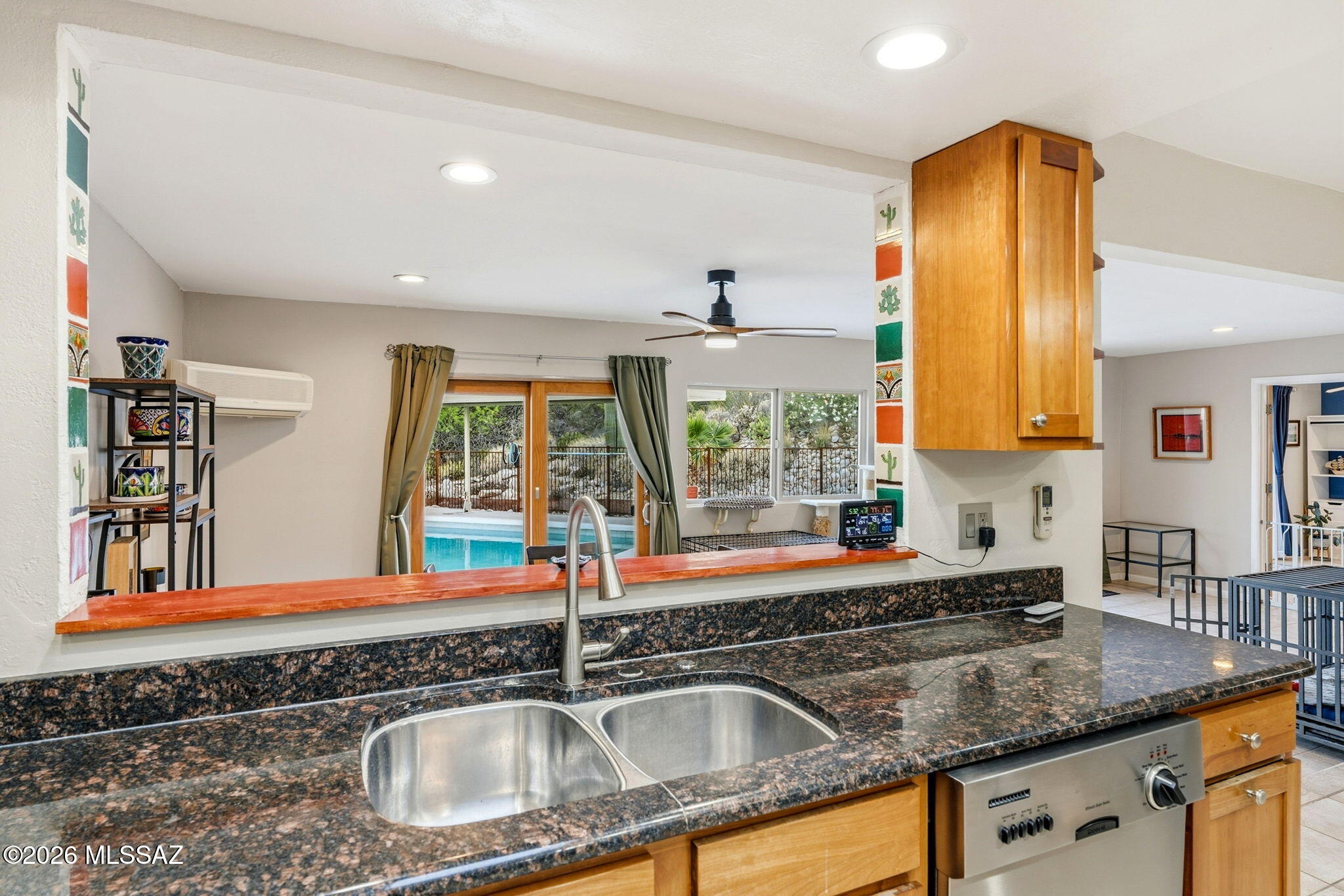 4641 North Rockcliff Road Tucson, AZ 85750 - Photo 18 of 48 View from kitchen sink, pool in distance