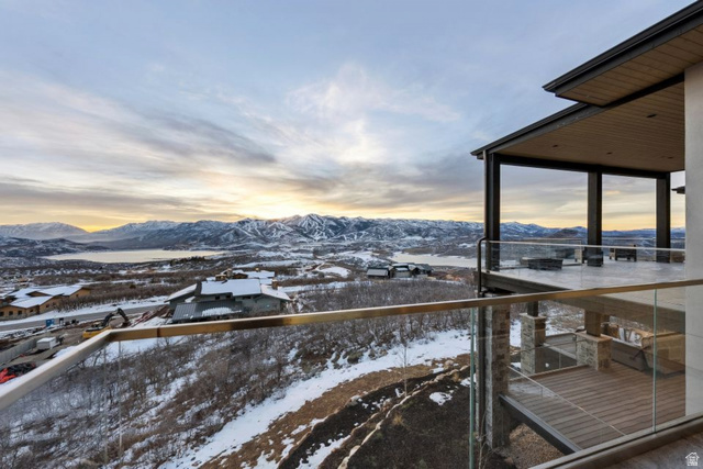2002 East Outlaw Road Kamas, UT 84036 - Photo 65 of 65 Expansive outdoor terrace featuring a glass railing system and a covered patio with a wood-finish ceiling