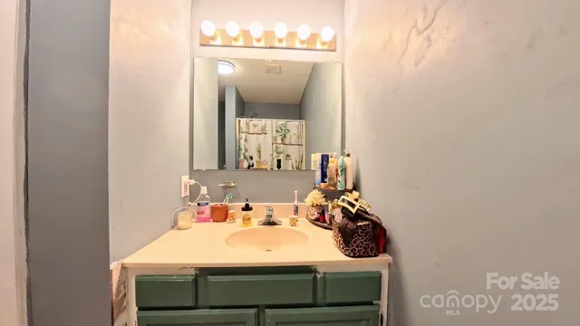 a bathroom with a sink a toilet and bathtub