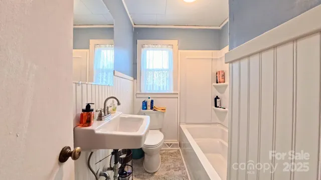 a view of a backyard with a tree