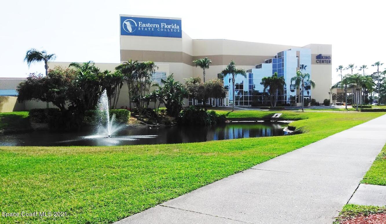 2648 Locksley Road Melbourne, FL 32935 - Photo 16 of 16 a view of a city with tall buildings