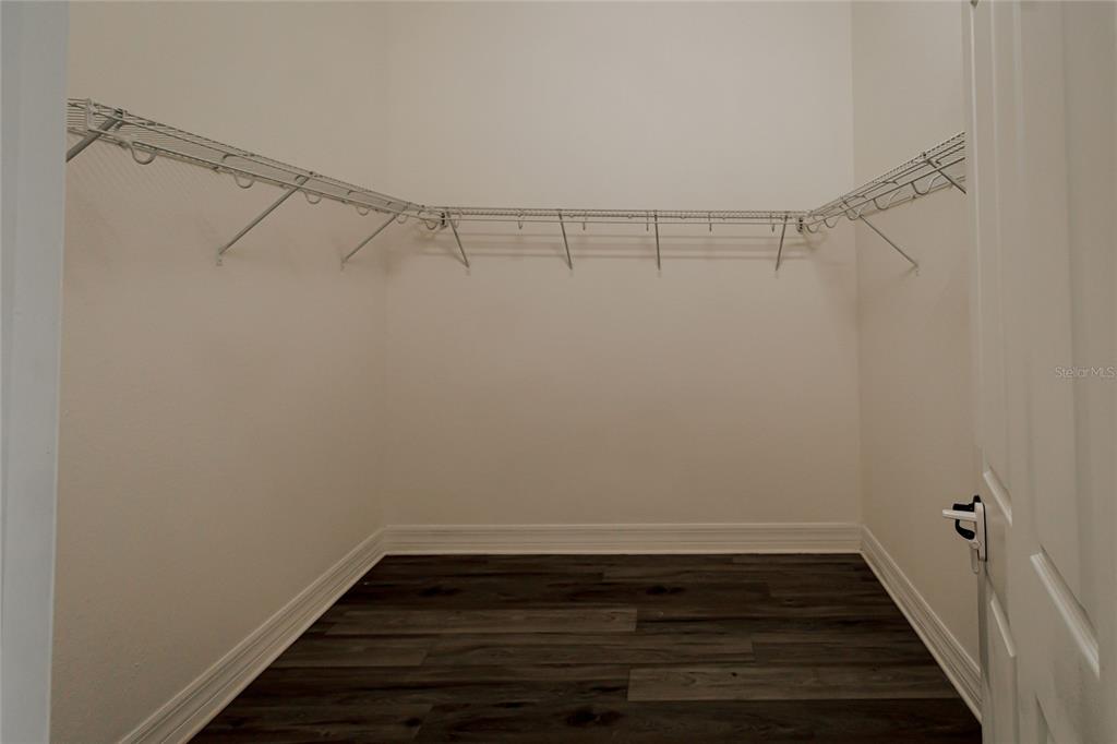 20315 Passagio Drive Venice, FL 34293 - Photo 15 of 40 a view of a room with racks on the wall