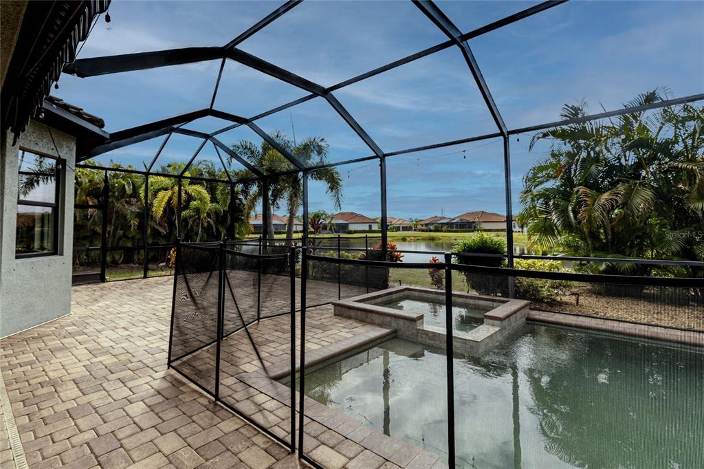 20315 Passagio Drive Venice, FL 34293 - Photo 21 of 40 a view of a swimming pool with a patio