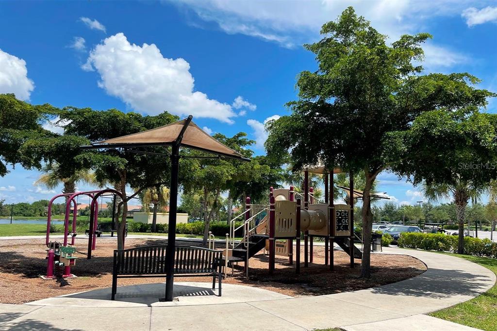 20315 Passagio Drive Venice, FL 34293 - Photo 33 of 40 a view of patio with chairs and tables