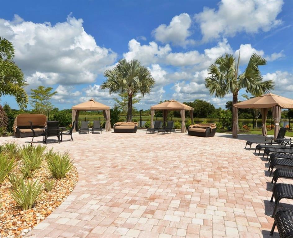 20315 Passagio Drive Venice, FL 34293 - Photo 37 of 40 a view of a house with yard and sitting area