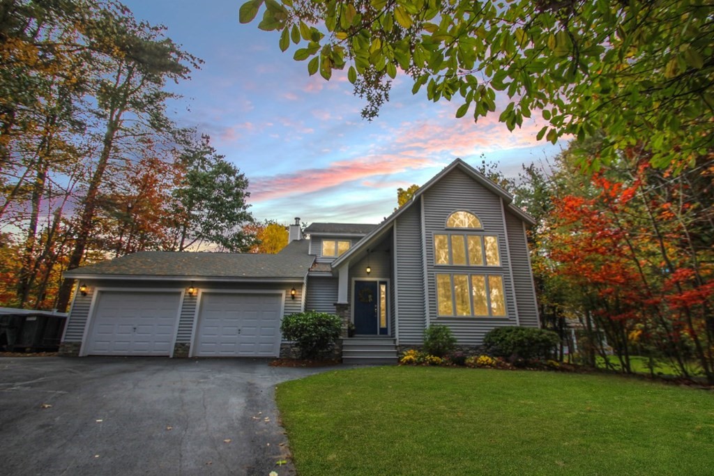 6 Patterson Road Shirley, MA 01464 - Photo 1 of 27 a front view of a house with a yard and garage