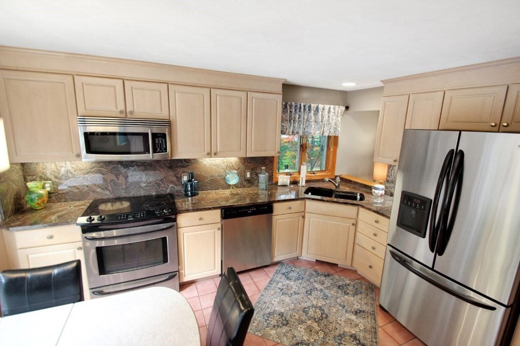 6 Patterson Road Shirley, MA 01464 - Photo 11 of 27 a kitchen with a sink stove and refrigerator