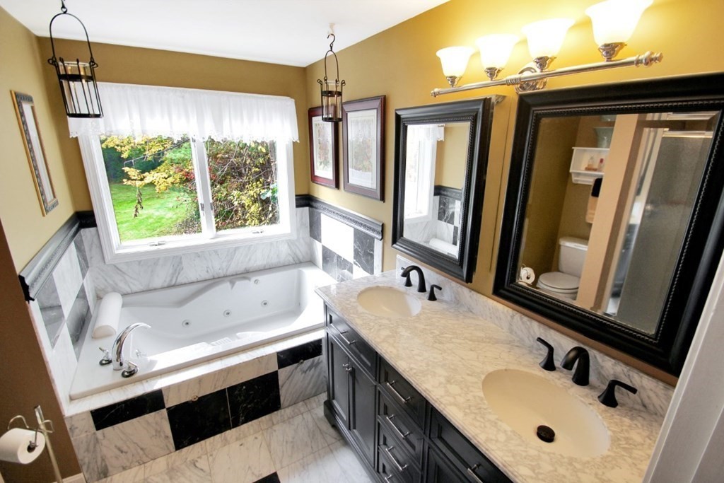 6 Patterson Road Shirley, MA 01464 - Photo 17 of 27 a bathroom with a tub sink and mirror