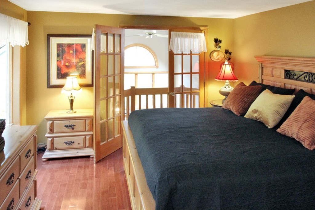 6 Patterson Road Shirley, MA 01464 - Photo 19 of 27 a bedroom with a bed and wooden floor