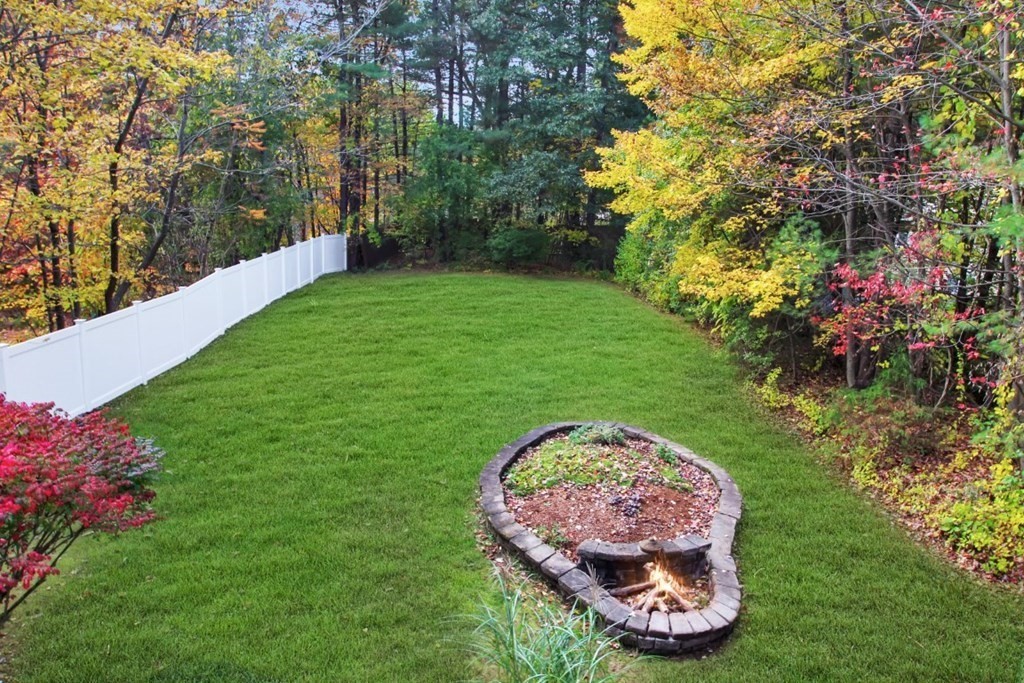 6 Patterson Road Shirley, MA 01464 - Photo 2 of 27 a view of a backyard with plants and a fountain