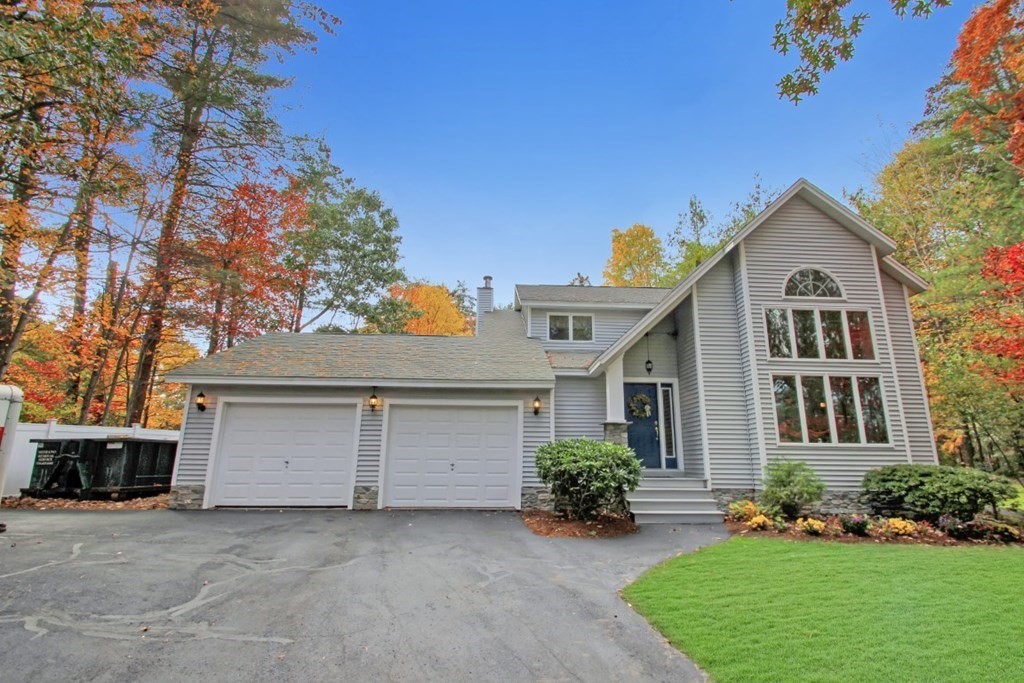 6 Patterson Road Shirley, MA 01464 - Photo 25 of 27 a view of a house with a yard and potted plants