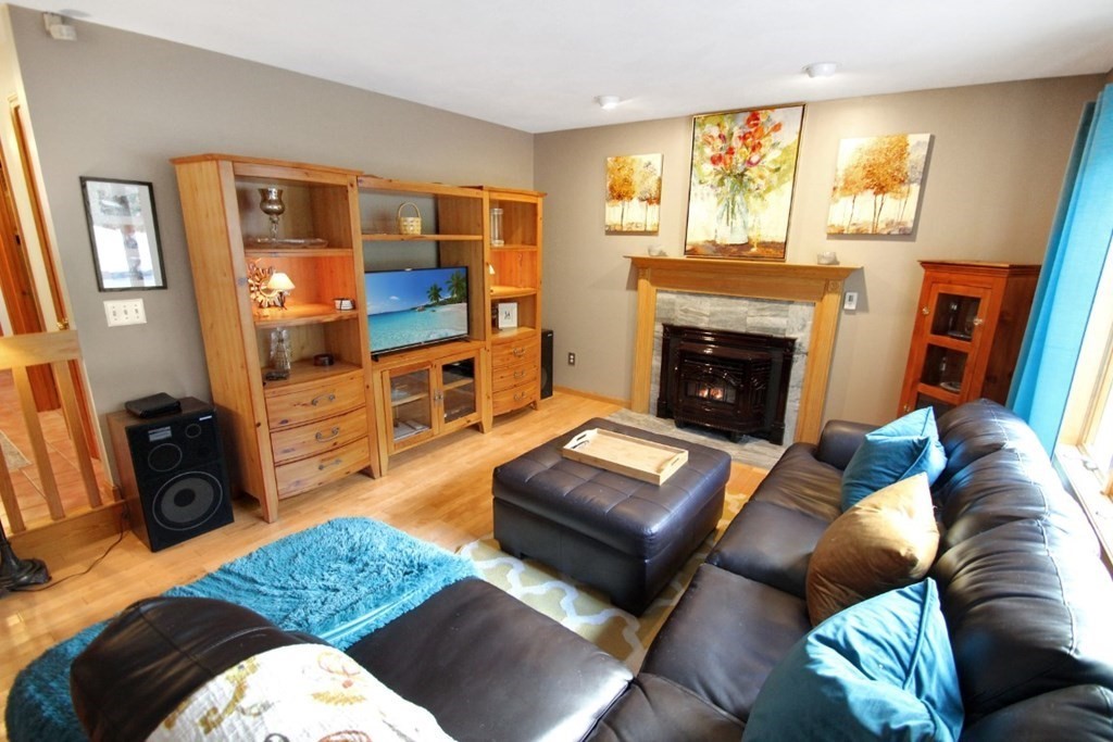 6 Patterson Road Shirley, MA 01464 - Photo 7 of 27 a living room with furniture and a fireplace