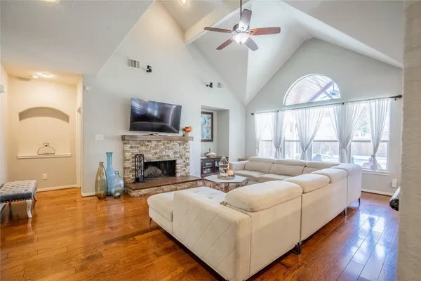 a spacious bedroom with a bed and a fireplace