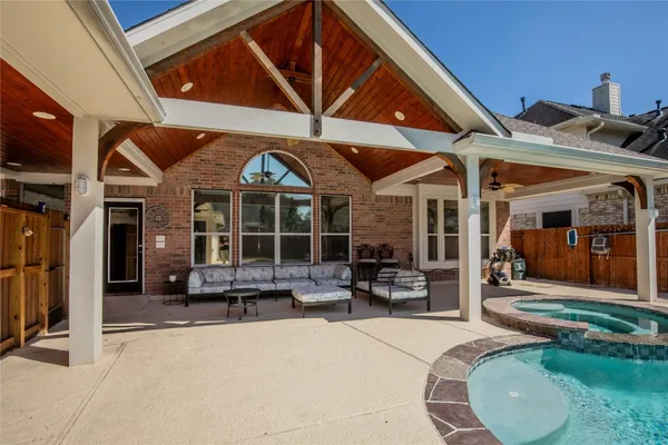 a front view of a house with patio furniture and porch