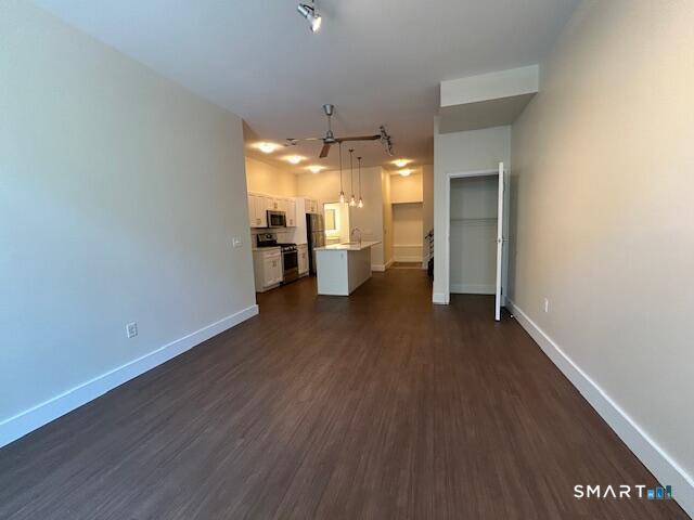 111 Morgan Street, Unit TH5 Stamford, CT 06905 - Photo 2 of 23 wooden floor in an empty room with a window