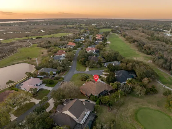 an aerial view of residential houses with outdoor space