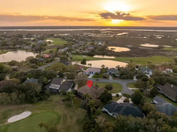 a living room with furniture and a mirror