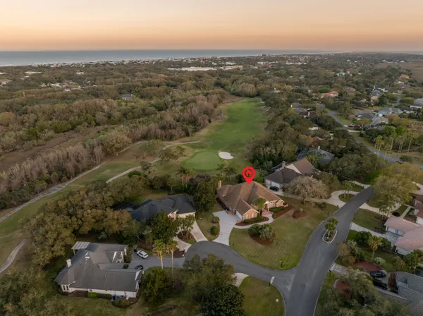 a white toilet sitting next to a shower curtain