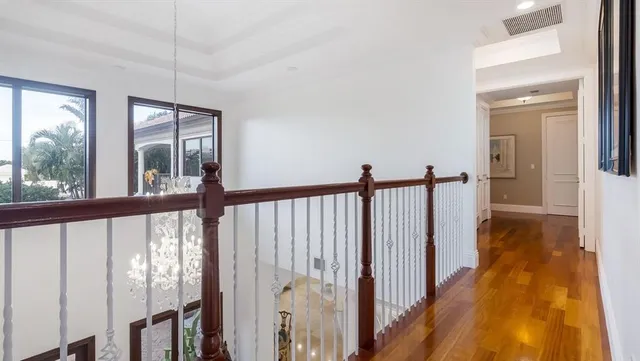 a spacious bedroom with a bed and a large window