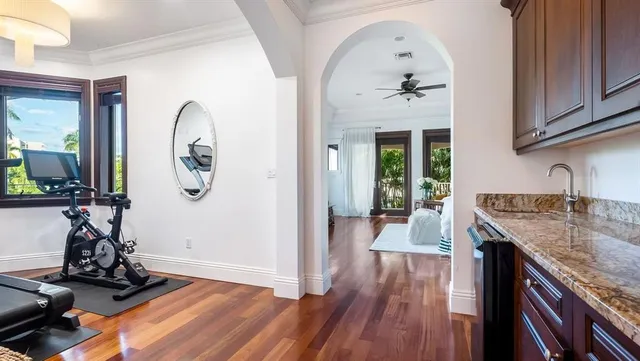 a spacious bathroom with a tub a sink and mirrors