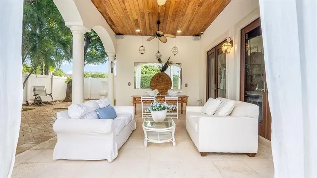 an aerial view of multiple houses with a yard