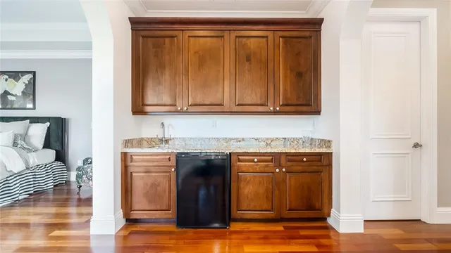 a bedroom with bed and window