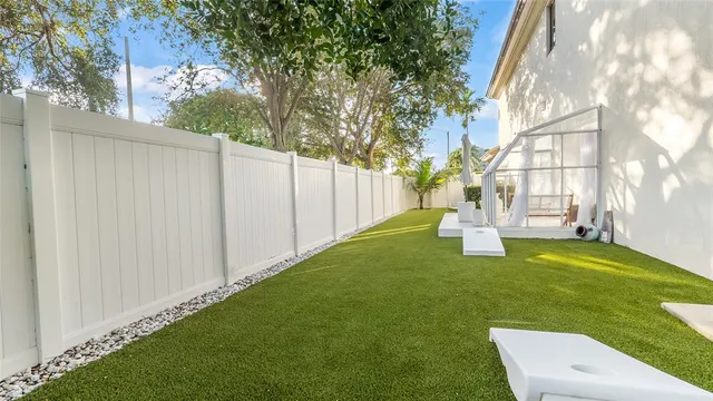 a view of living room with furniture and a potted plant