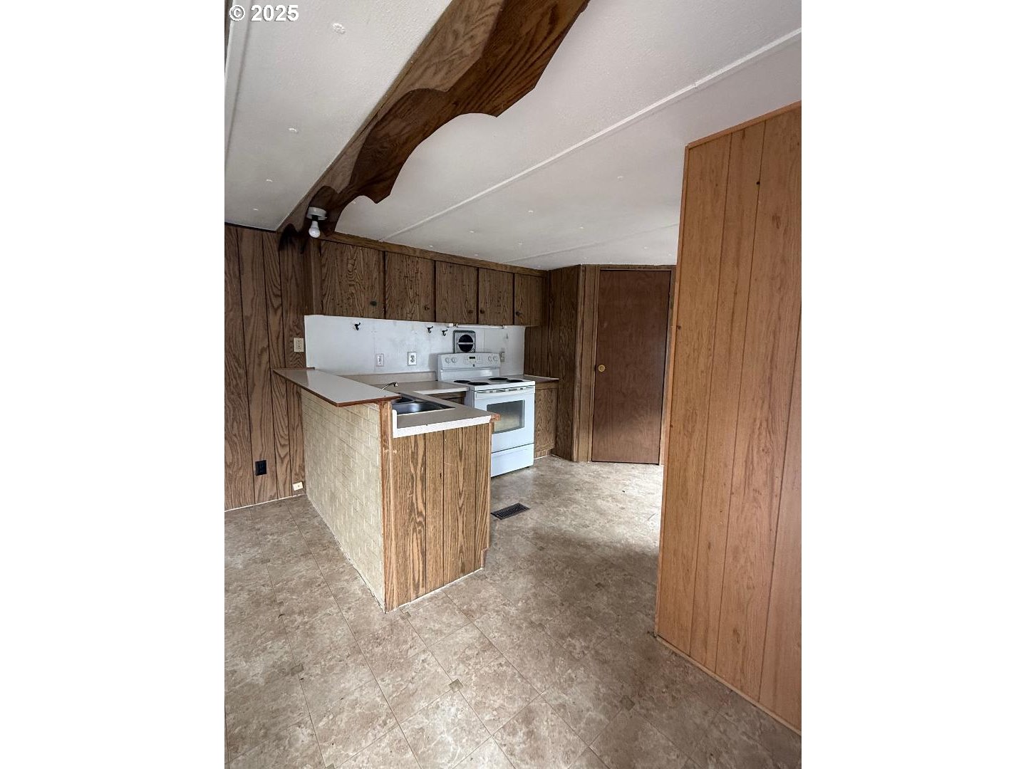 5000 Northeast Stephens Street, Unit 9 Roseburg, OR 97470 - Photo 2 of 12 a kitchen with granite countertop a sink and a stove