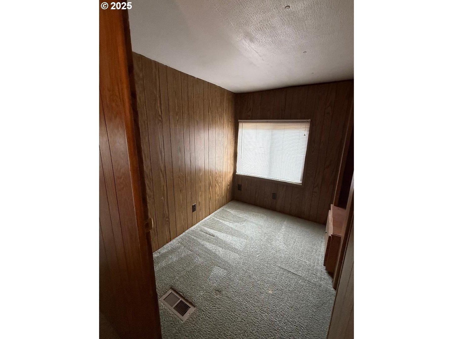 5000 Northeast Stephens Street, Unit 9 Roseburg, OR 97470 - Photo 9 of 12 a view of an empty room with windows