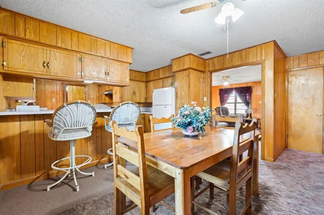 a kitchen with a appliances a stove and a refrigerator