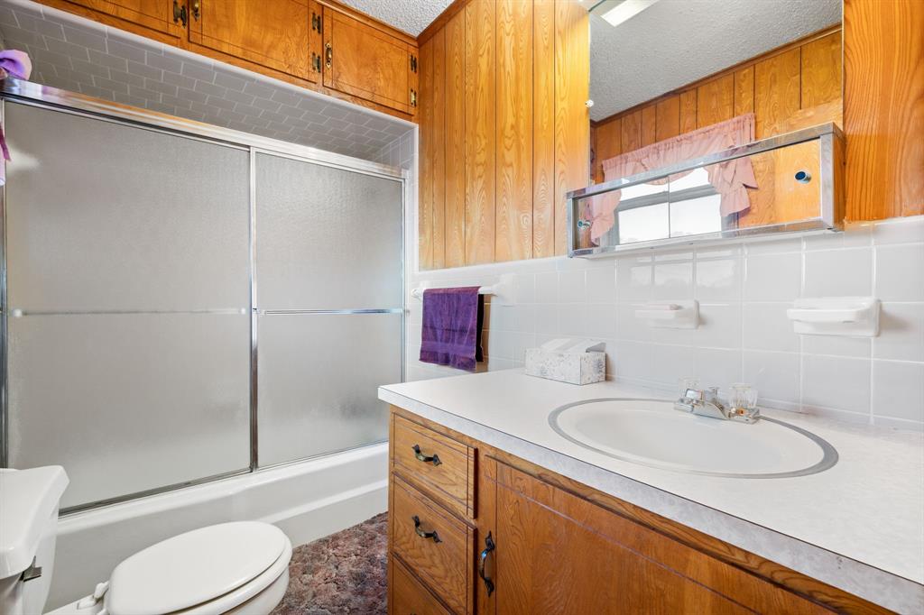 596 North FM 129 Santo, TX 76472 - Photo 21 of 40 a bathroom with a sink toilet and shower