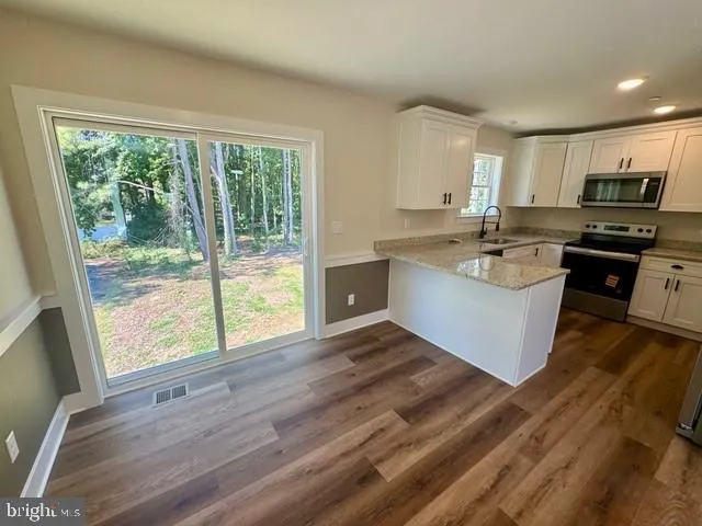 a bathroom with double vanity sink and mirror