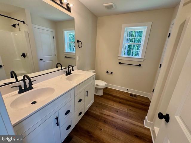 Harbor Drive Chester, MD 21619 - Photo 9 of 12 a bathroom with double vanity sink and mirror
