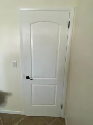 a bathroom with a glass shower door