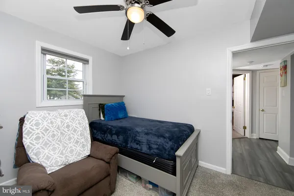 a living room with a couch and a window