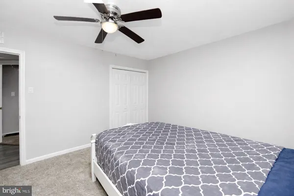 a large bedroom with a bed