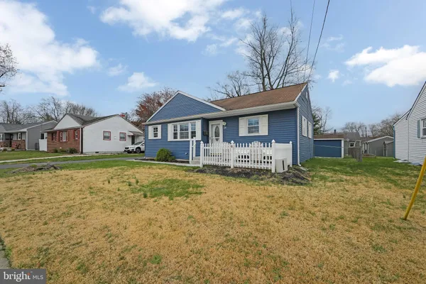 a house view with swimming pool in front of it