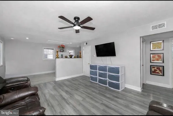 a view of a livingroom with furniture and wooden floor
