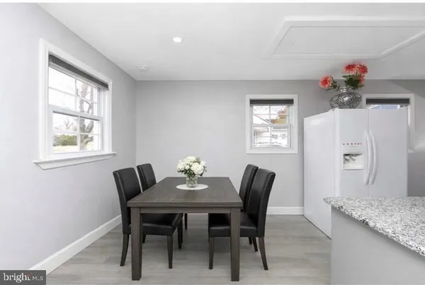 a view of a dining room with furniture and window