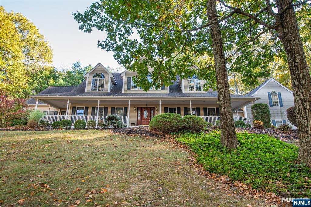 190 Andover Mohawk Road Andover, NJ 07821 - Photo 11 of 45 a front view of a house with a garden